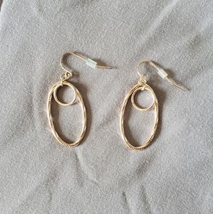 Rose gold toned earring set.